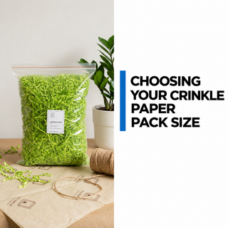 A clear pack of Lime Green crinkle paper on a packing table beside tissue, twine and a plant.